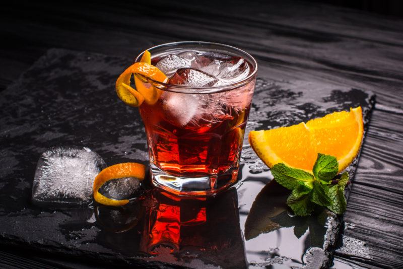 A negroni made using tequila on a black table