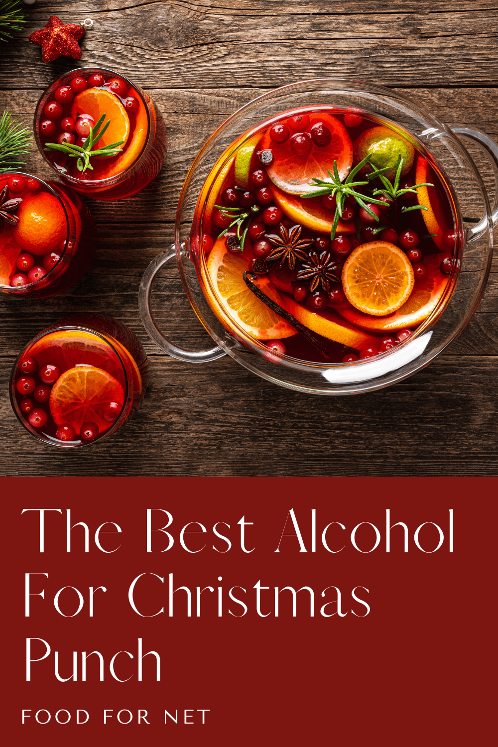 Best Alcohol For Christmas Punch. A large bowl and three small glasses containing Christmas punch, which includes oranges, cranberries, and rosemary, along with alcohol