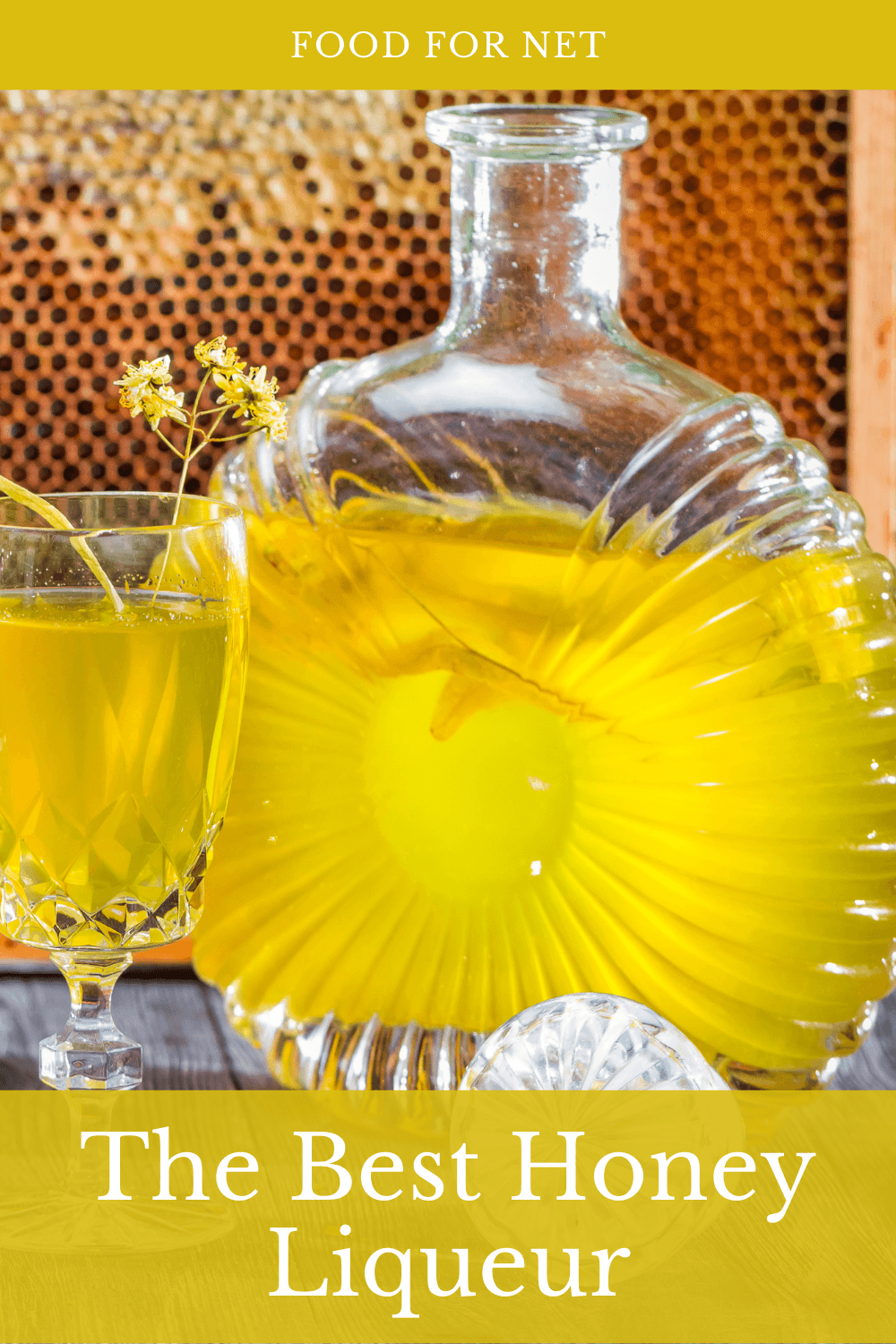 A bottle of honey liqueur, next to two glasses of the liqueur