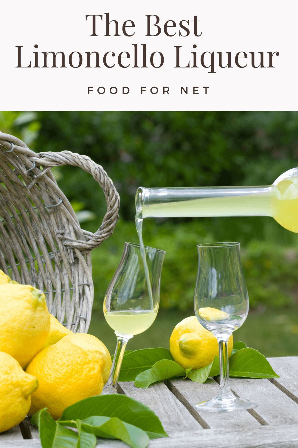 A glass of limoncello liqueur being poured from a bottle