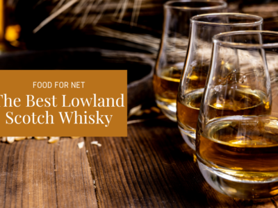 Three glasses of some of the best lowland Scotch whisky on a wooden bar