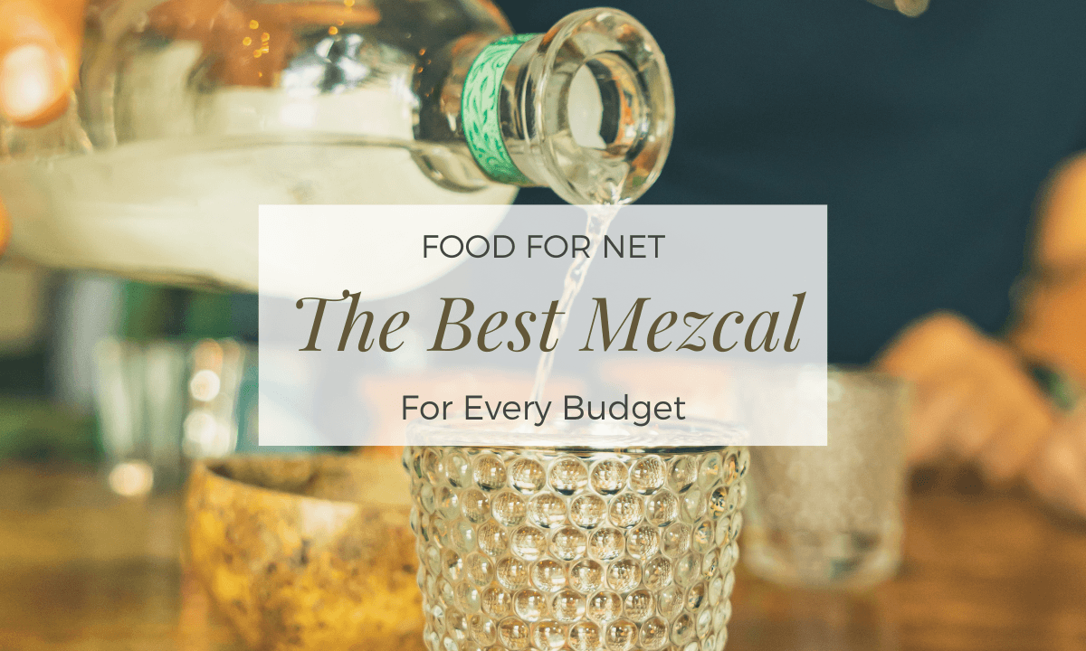 Mezcal being poured from a bottle into shot glasses