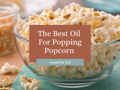 A large glass bowl filled with popcorn that has been prepared using some of the best oil for popping popcorn