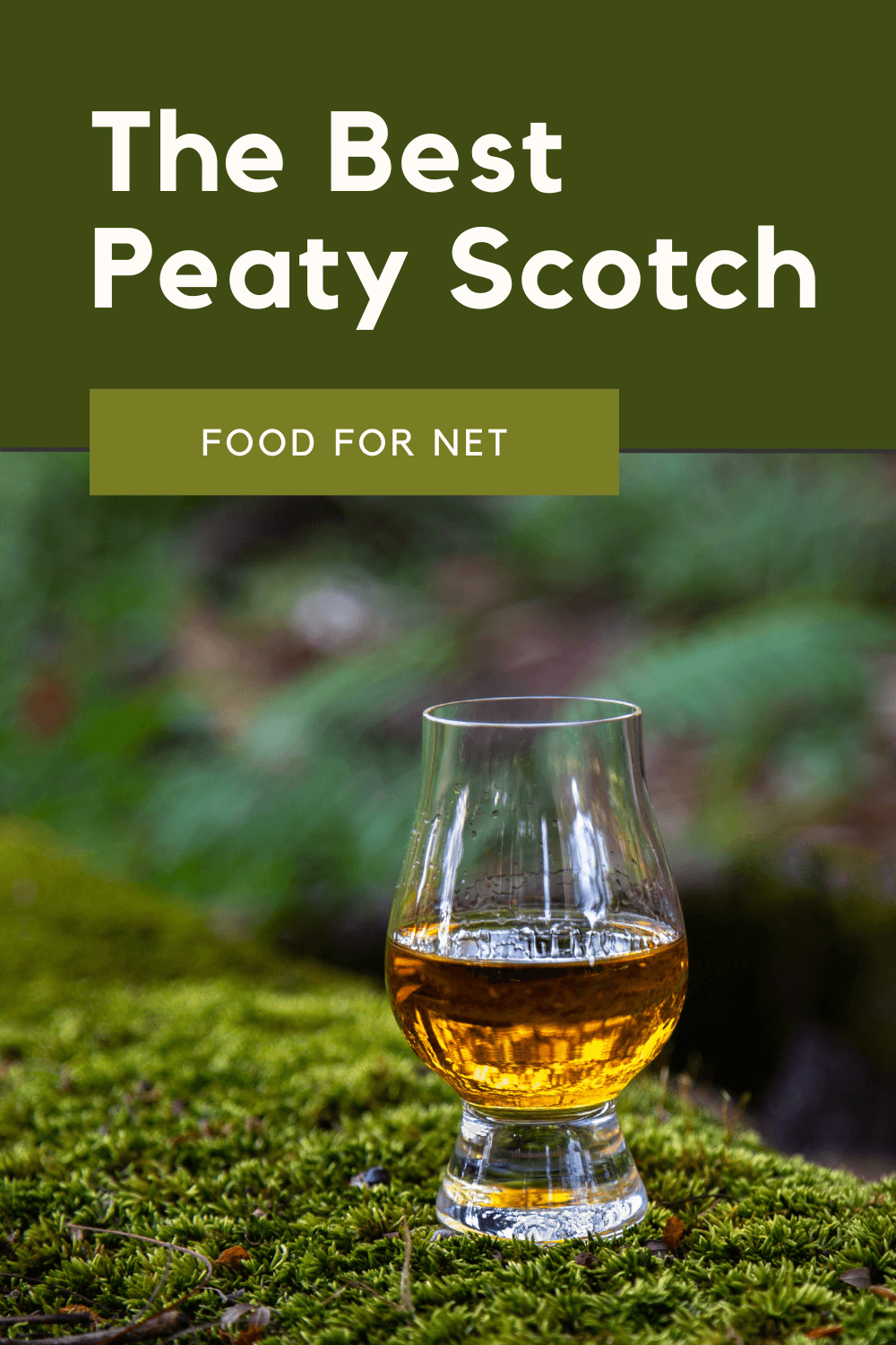 A glass of peaty Scotch on a mossy tree or mound, highlighting the idea of the best peaty Scotch