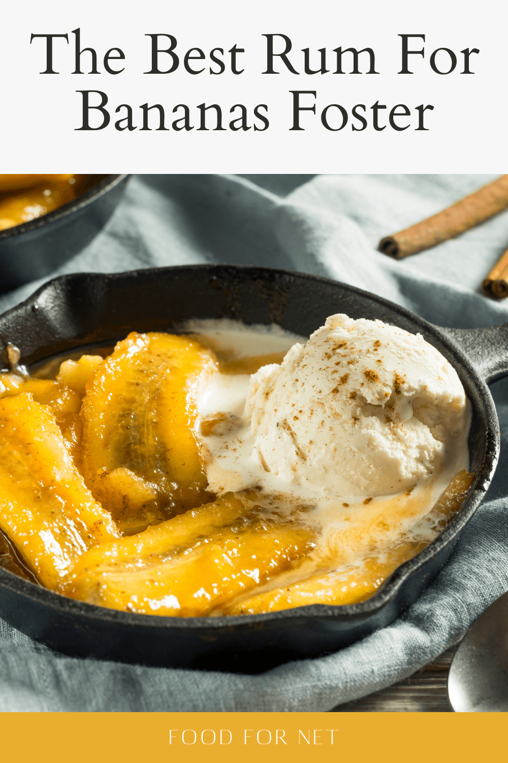 A black cast iron pan with bananas foster and ice cream