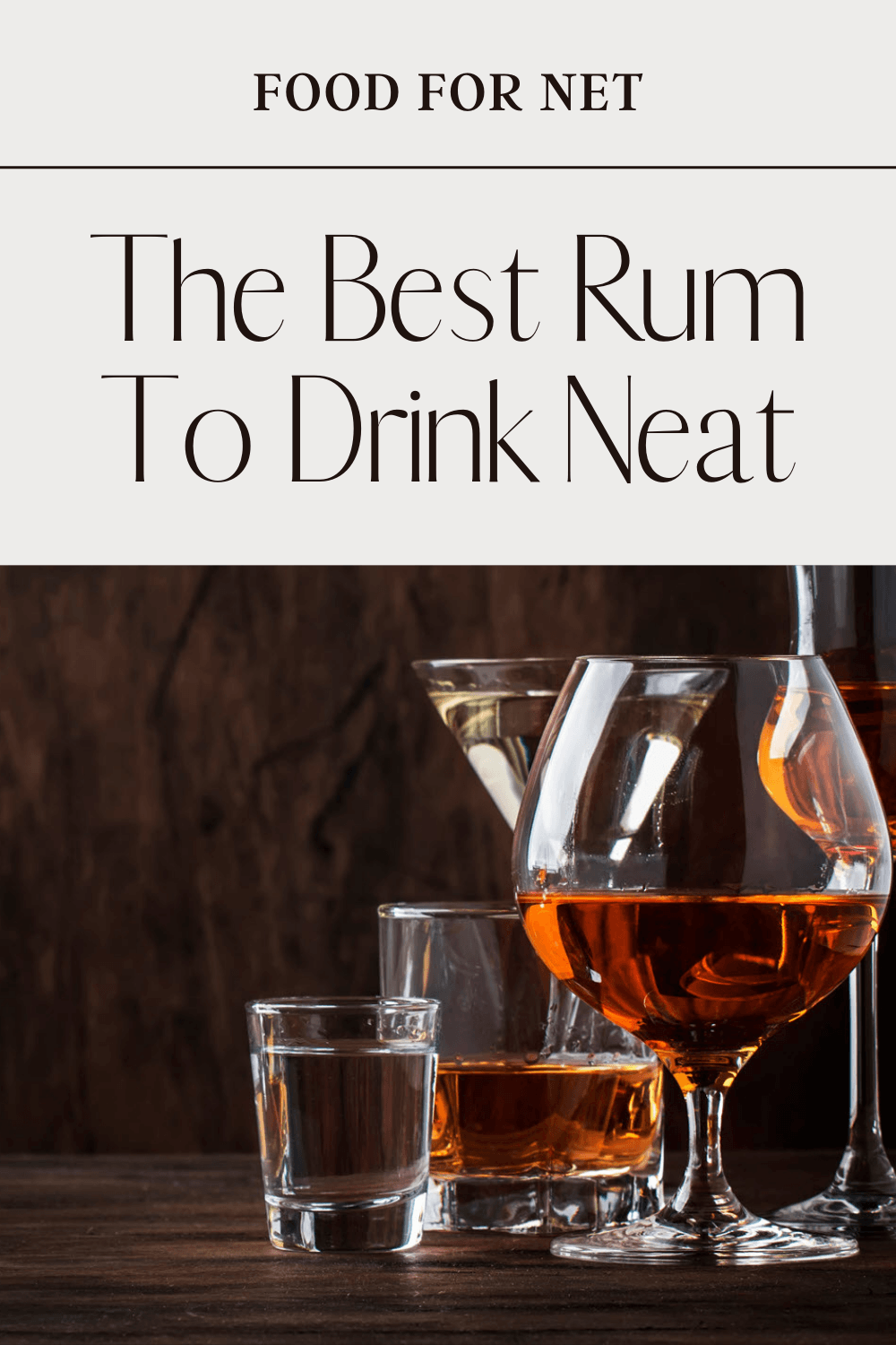 A selection of rum and other spirits in glasses against a dark wooden wall