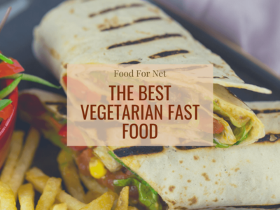 Two vegetarian wraps from a fast food store, next to fries and a salad
