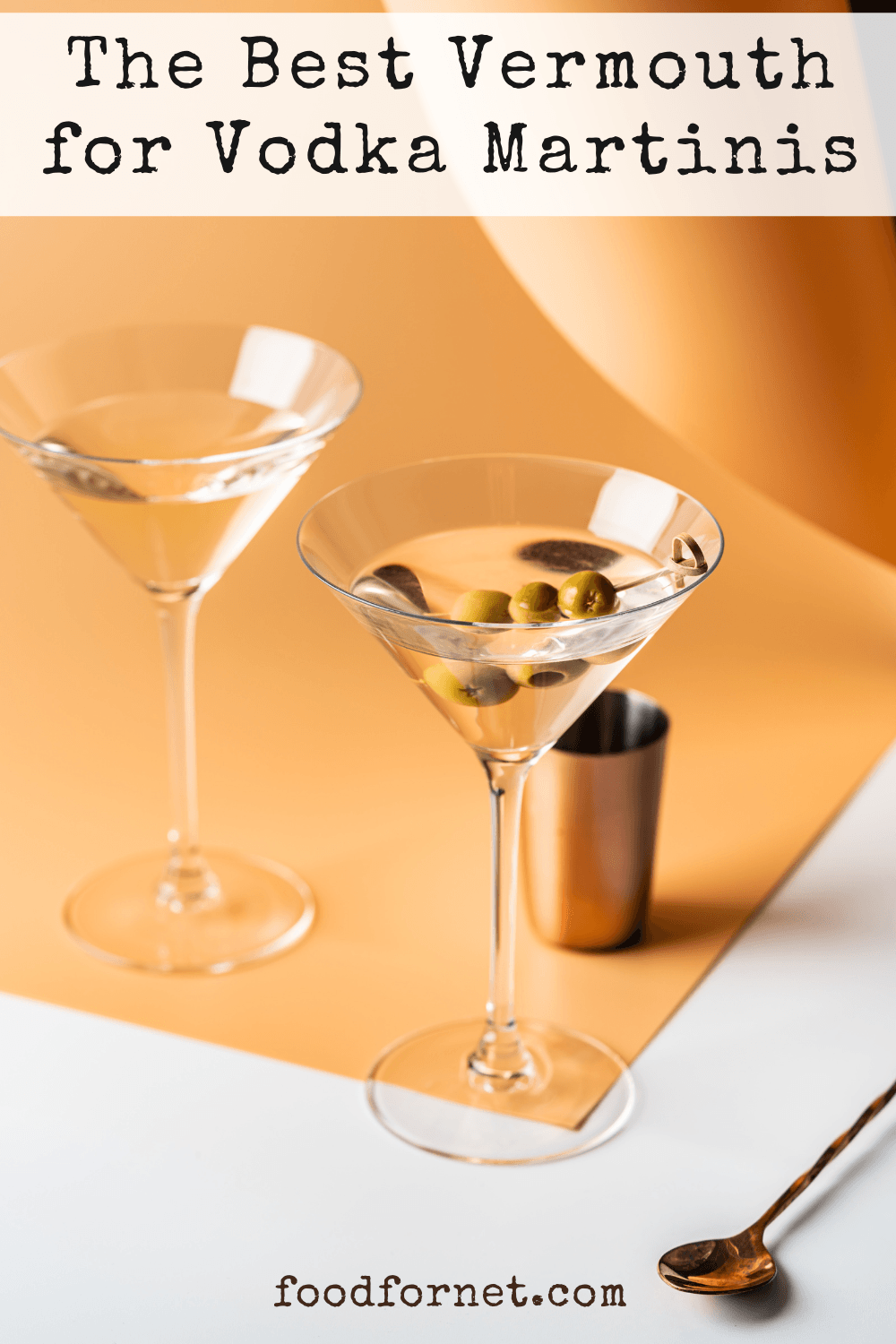 Two vodka martinis made with the best vermouth, with three olives each as a garnish