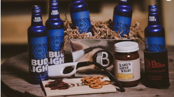 Selection of 5 Bud Light bottles and various snacks.