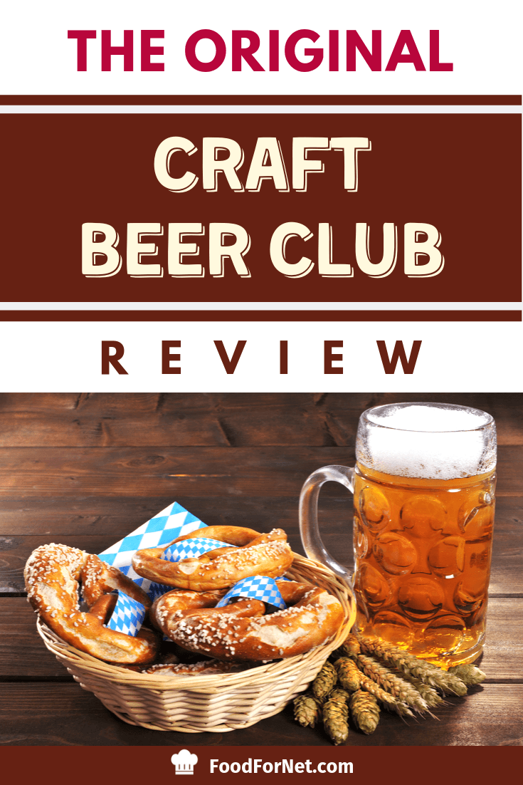 beer in large beer stein with baked pretzels and large salt on wooden table