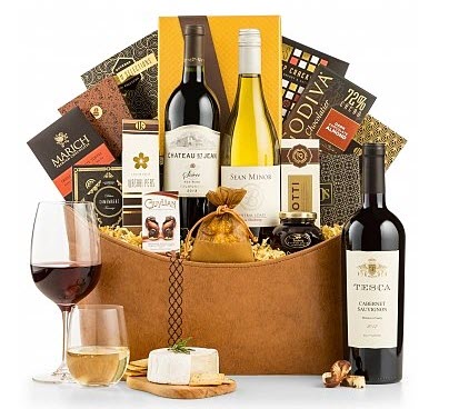 The Premier Selection | Food For Net A light brown basket with various snacks and wine