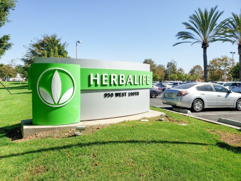 Outside Herbalife headquarters, where there is a sign with the company's logo on it