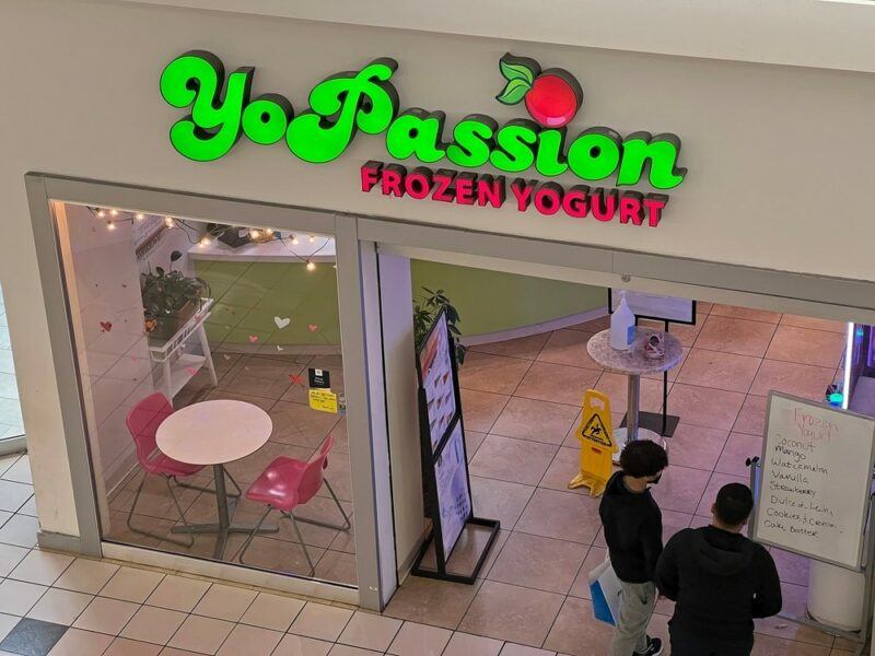 The store front of an American YoPassion frozen yogurt store