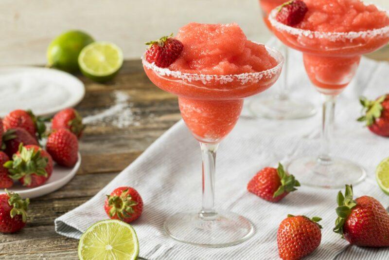 Three glasses of a frozen strawberry martini or daiquiri 