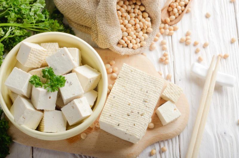 Cubed tofu, with a piece of tofu and soybeans