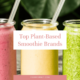 Three smoothies in mason jars with straws, looking at the best plant-based smoothie brands