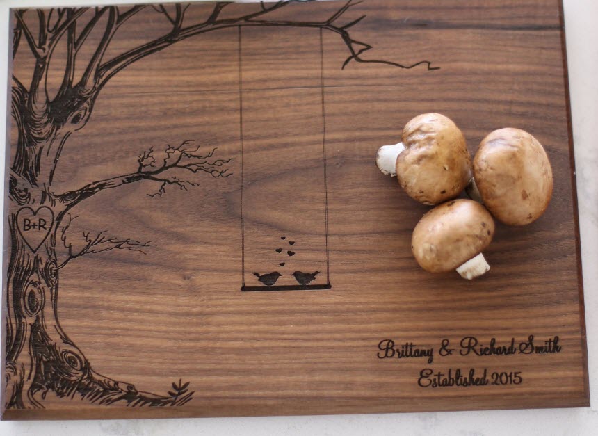 Tree-Of-Love-Cutting-Board | Food For Net A cutting board with an engraved tree and some mushrooms