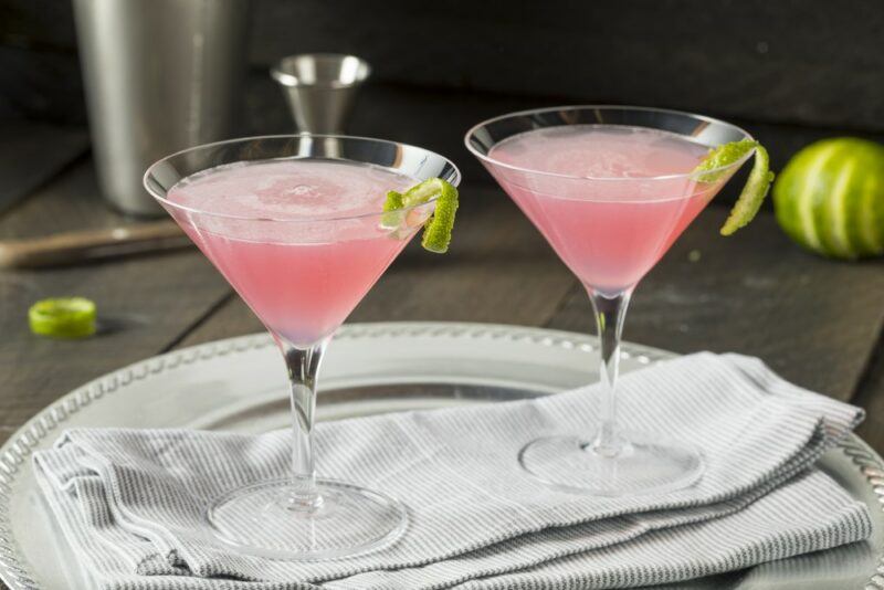 Two light pink adrenaline shot cocktails on a metal tray