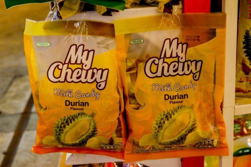 Two bags of durian candy hanging in a store