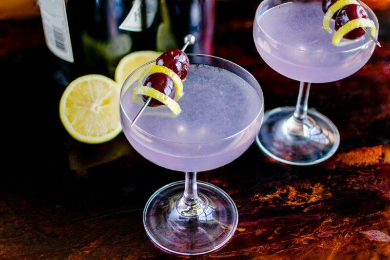 Two aviation cocktails served in coupe glasses