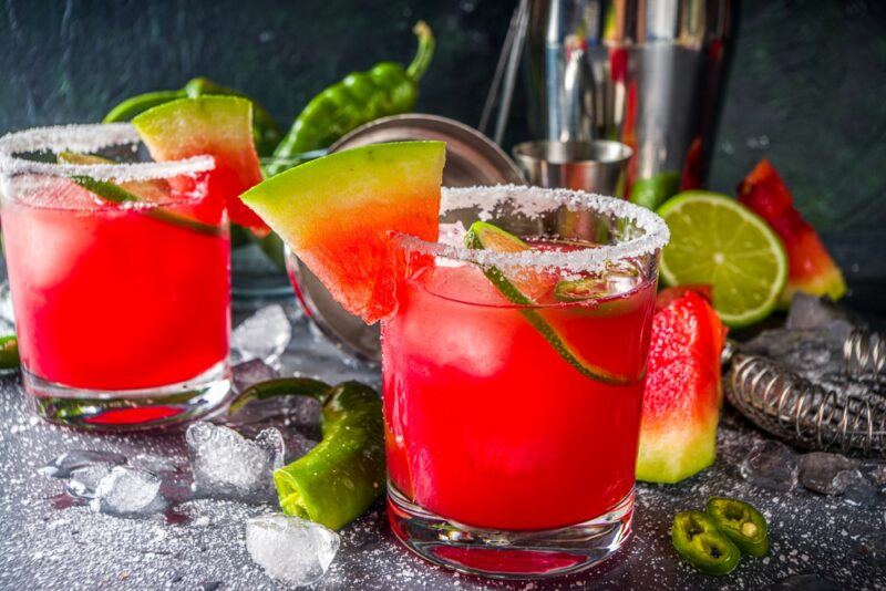 Two glasses containing a Mexican cocktail made using watermelons and jalapeno