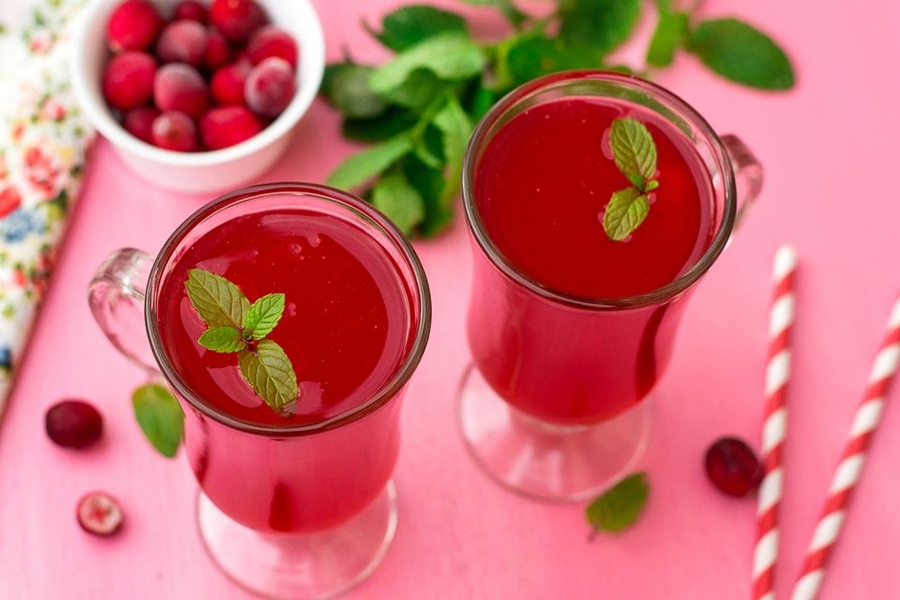 A pink table with two glasses of Russian kissel