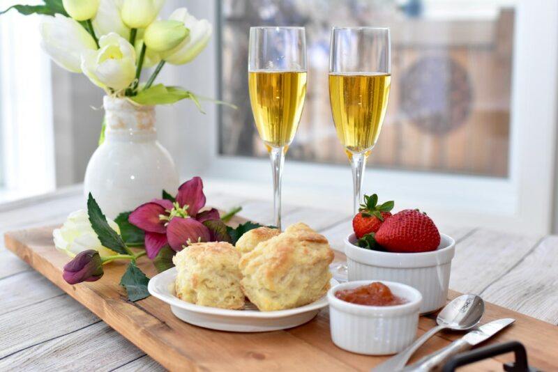 Two glasses containing Arnold Palmer mimosas, as part of a full Mother's day breakfast