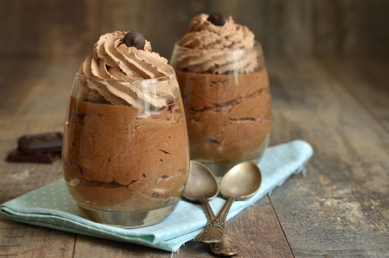 Two glasses with chocolate mousse | Food For Net Two glasses of chocolate mousse on a blue cloth with spoons