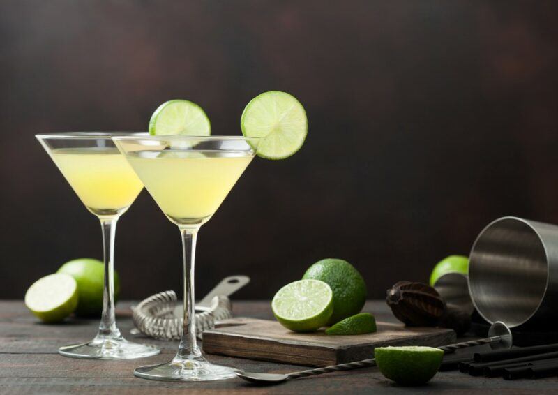 Two kamikaze cocktails in martini glasses with a circle of lime