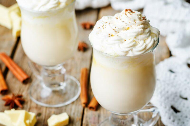 Two large glasses of white hot chocolate made with coconut rum