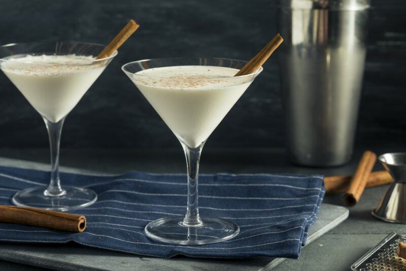 Two martini glasses containing a white Cowboy cocktail