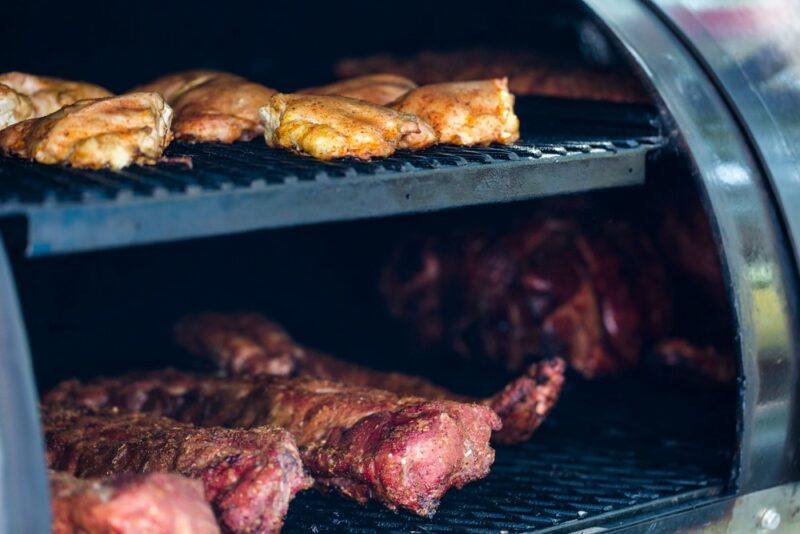 Two tiers of meat in a smoker | Food For Net Two shelves in a smoker, with different types of meat