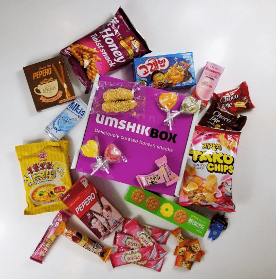 Selection of snacks and sweets against a white background