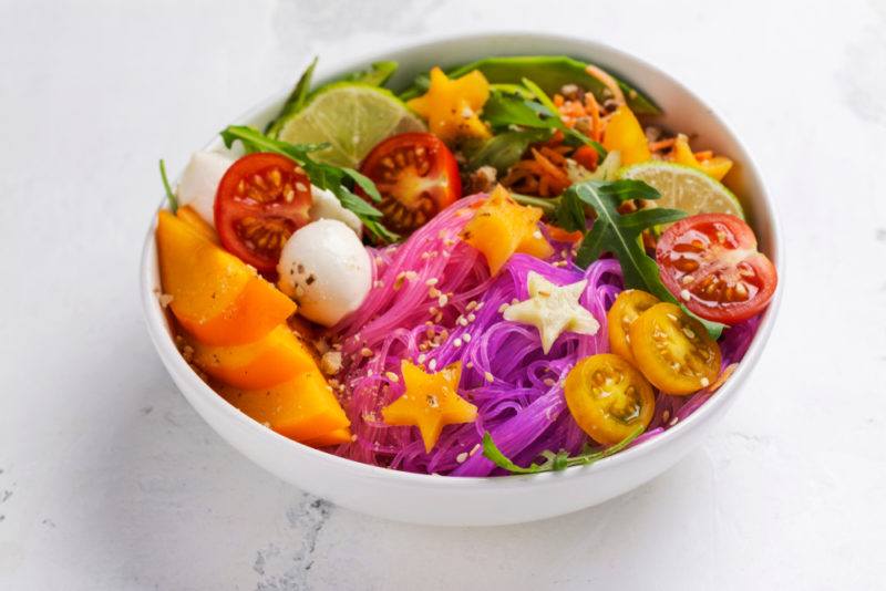 A white bowl with colored ingredients, including stars