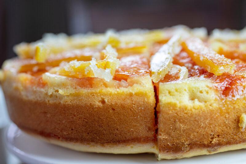 a closeup image of candied orange upside down cake