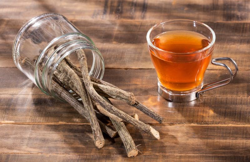 Valerian root tea next to a jar of the roots