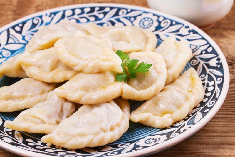 Vareniki dumplings on a blue and white plate