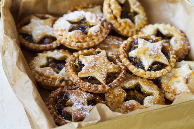 A selection of small Christmas mince pies with stars in a box