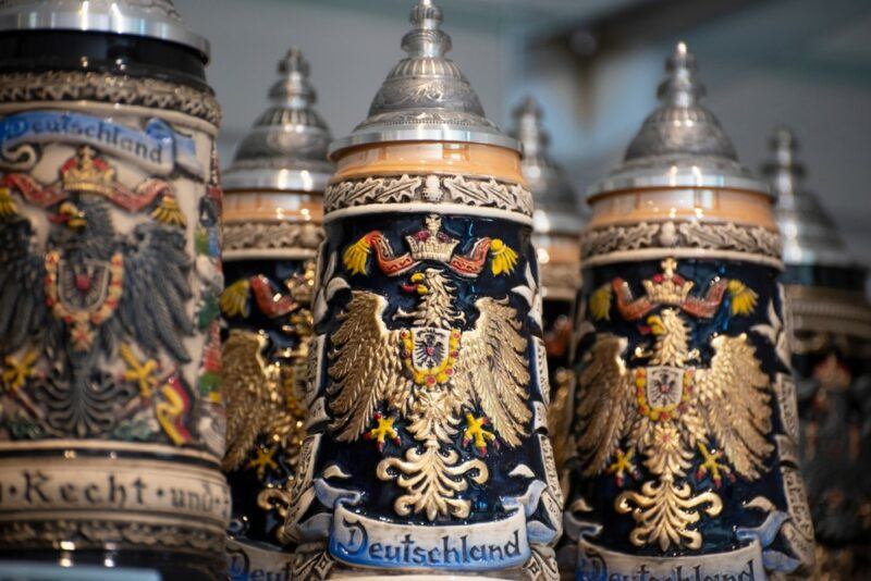 A collection of German beer steins that have been carved with careful attention