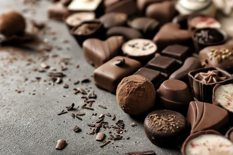 A selection of chocolates, including ones made with dark chocolate, milk chocolate, and white chocolate