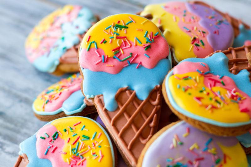 Iced cookies in the shape of ice cream cones with colored icing