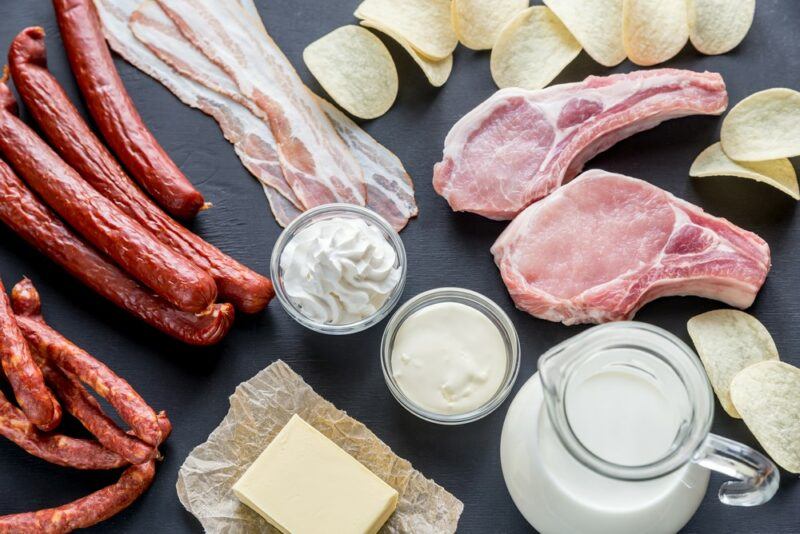 A selection of foods containing saturated fat including butter and bacon