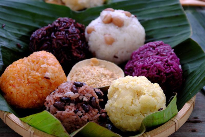 A selection of sticky rice balls that are called xoi