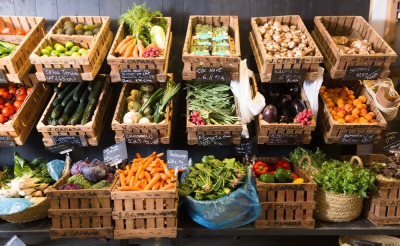 A selection of fresh vegetables being sold in a market in Spain