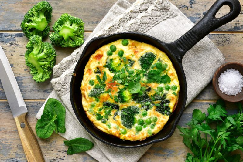 A vegetable omelet in a cast iron pan