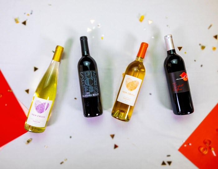 4 bottles of wine against a white background