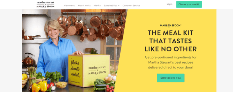 An image of Martha Stewart with a box from Martha and Marley Spoon