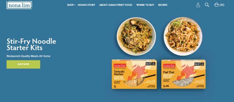 A website screenshot from Nona Lim showing two bowls of ramen and two packets against a blue background