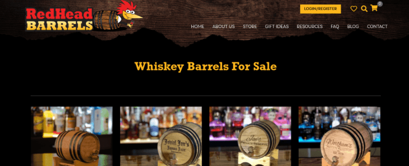 A website screenshot from RedHead Barrels showing a black background with small whiskey barrels on a bar