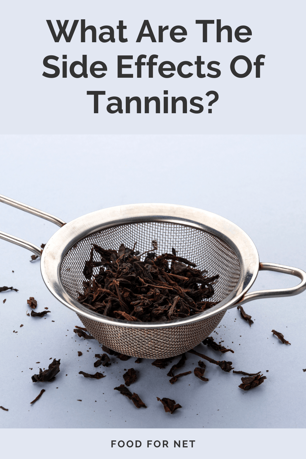 What Are The Side Effects Of Tannins. A strainer containing tea leaves on a light table, highlighting the possible side effects of tannins